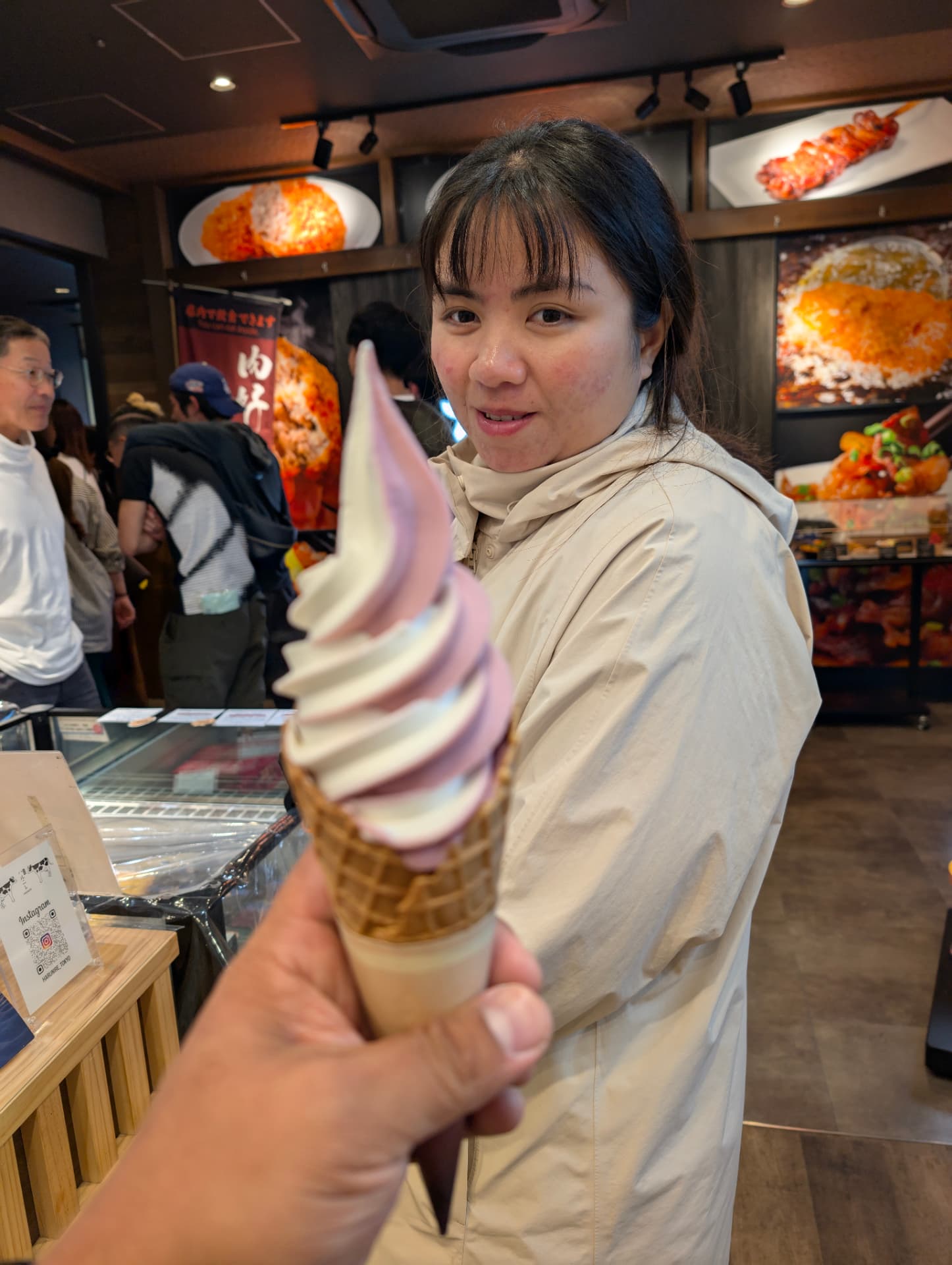 Sam sharing a pink and vanilla soft serve